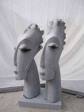 Grey Face In Stone Statue