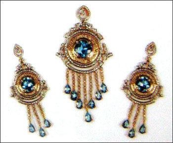Sensuous Blue Topaz And Diamond Earrings With Pendent