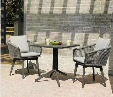 Outdoor aluminum table and rope chair with cushion pillows