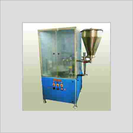 CUP FILLING AND SEALING MACHINE
