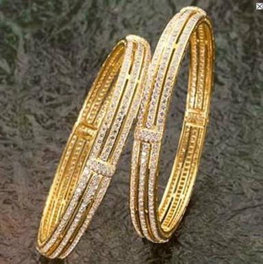 Diamond studded gold bangle