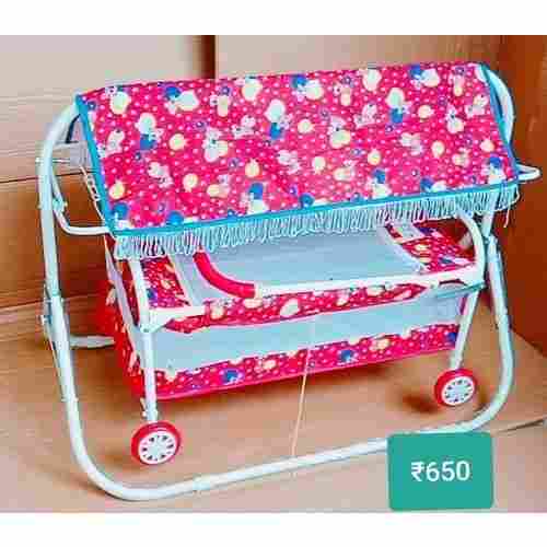Attractively Polished With 4 Movable Wheel Type Pink Baby Cradle