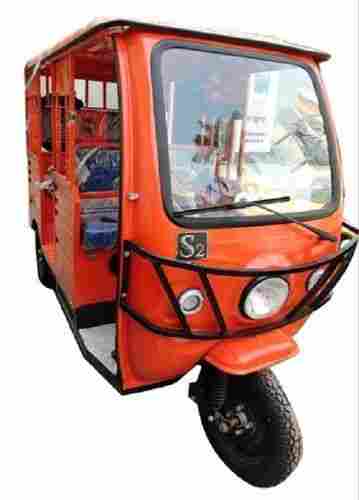 Four Seater Vehicle Orange And Black Battery Operated E Rickshaw 