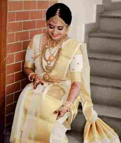 Designer Fancy Stylish Bridal Wear White And Golden Silk Saree